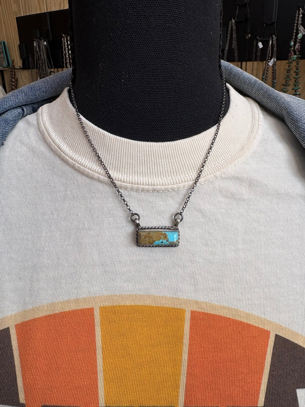 23. Chassity Belone mini turquoise bar necklace