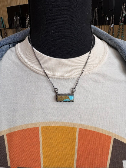 23. Chassity Belone mini turquoise bar necklace